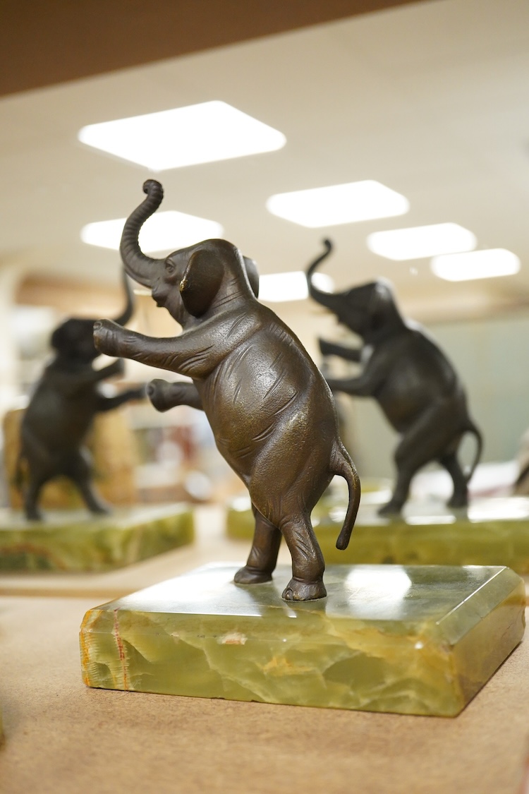 Two Art Deco bronze elephants and a cold painted bronze parakeet group, all on green onyx bases, tallest 17cm